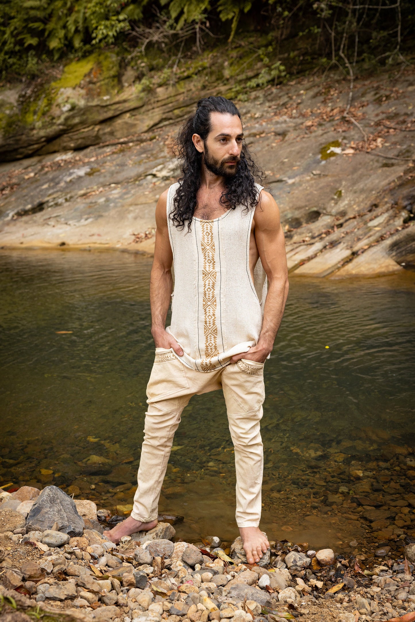 Our KAZA tank top is handmade of 100% natural semi-see-through cotton and decorated with tribal patterns via a block printing process using natural dyes . . .

Featuring a deep cut sleeveless design to maximise air flow and comfort . . .