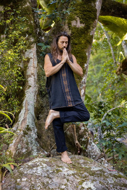 Our KAZA tank top is handmade of 100% natural semi-see-through cotton and decorated with tribal patterns via a block printing process using natural dyes . . .

Featuring a deep cut sleeveless design to maximise air flow and comfort . . .