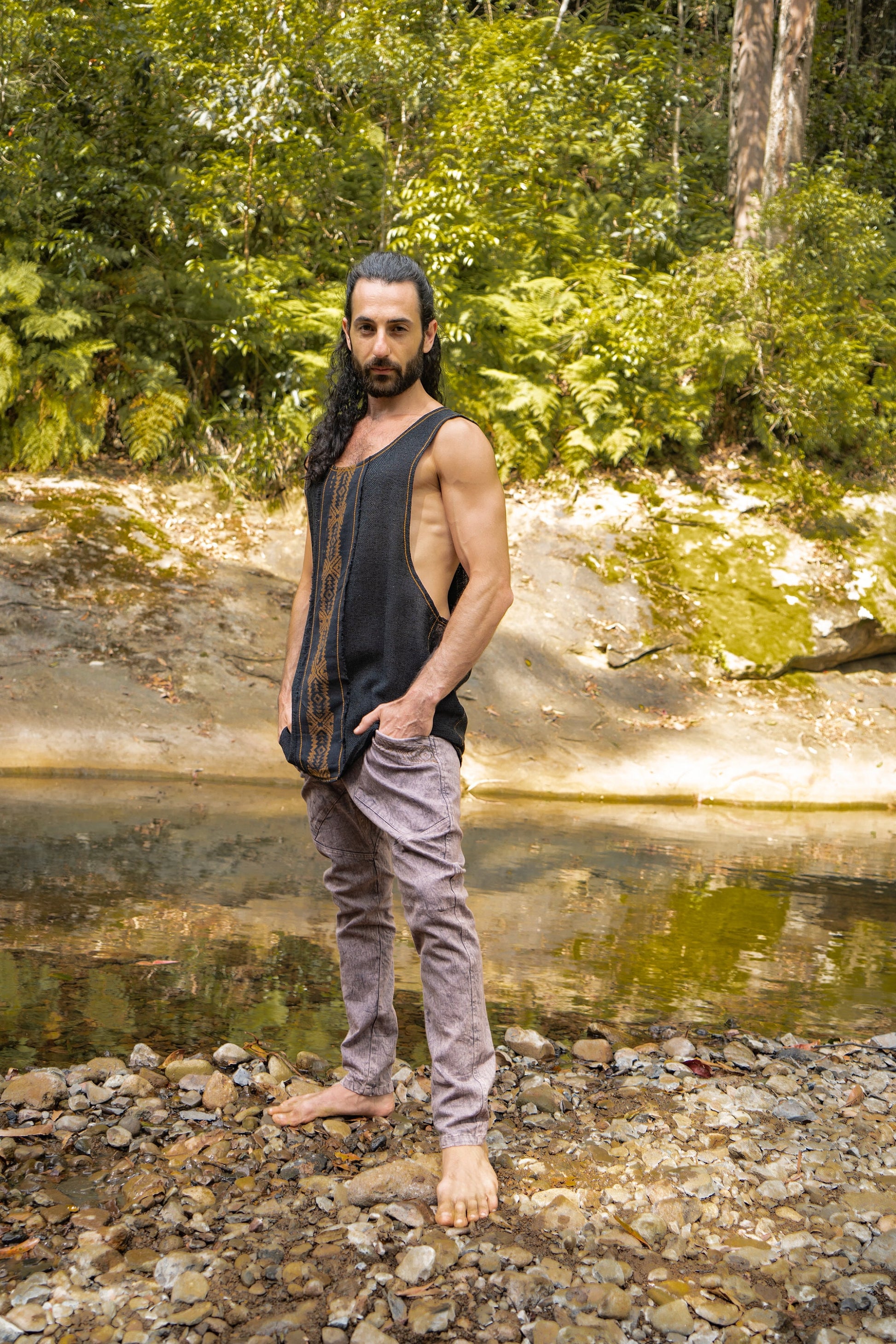 Our KAZA tank top is handmade of 100% natural semi-see-through cotton and decorated with tribal patterns via a block printing process using natural dyes . . .

Featuring a deep cut sleeveless design to maximise air flow and comfort . . .