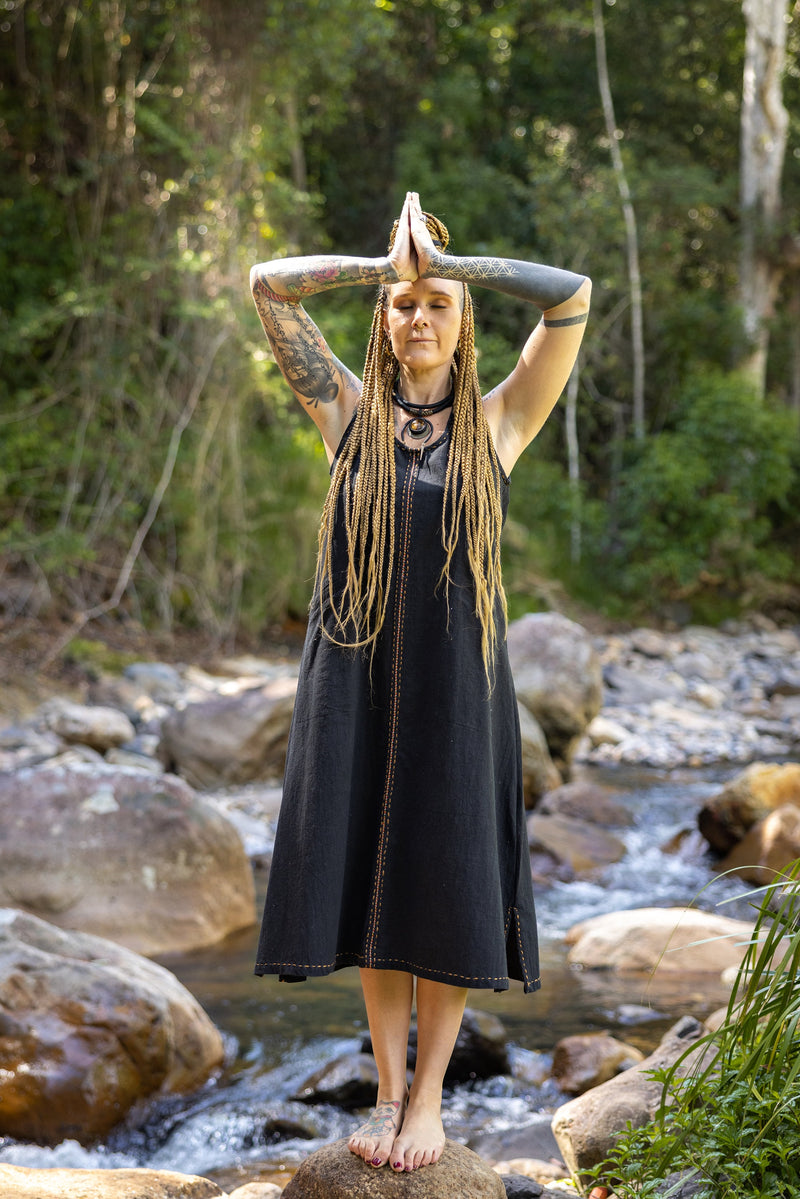 Our AHUA dress is a beautifully handmade piece made of 100% natural cotton. Its simple, free-flowing design is both comfortable and stylish. 
Featuring two convenient pockets and is decorated with intricate hand-woven embroidery.