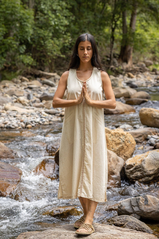 Our AHUA dress is a beautifully handmade piece made of 100% natural cotton. Its simple, free-flowing design is both comfortable and stylish. 
Featuring two convenient pockets and is decorated with intricate hand-woven embroidery.