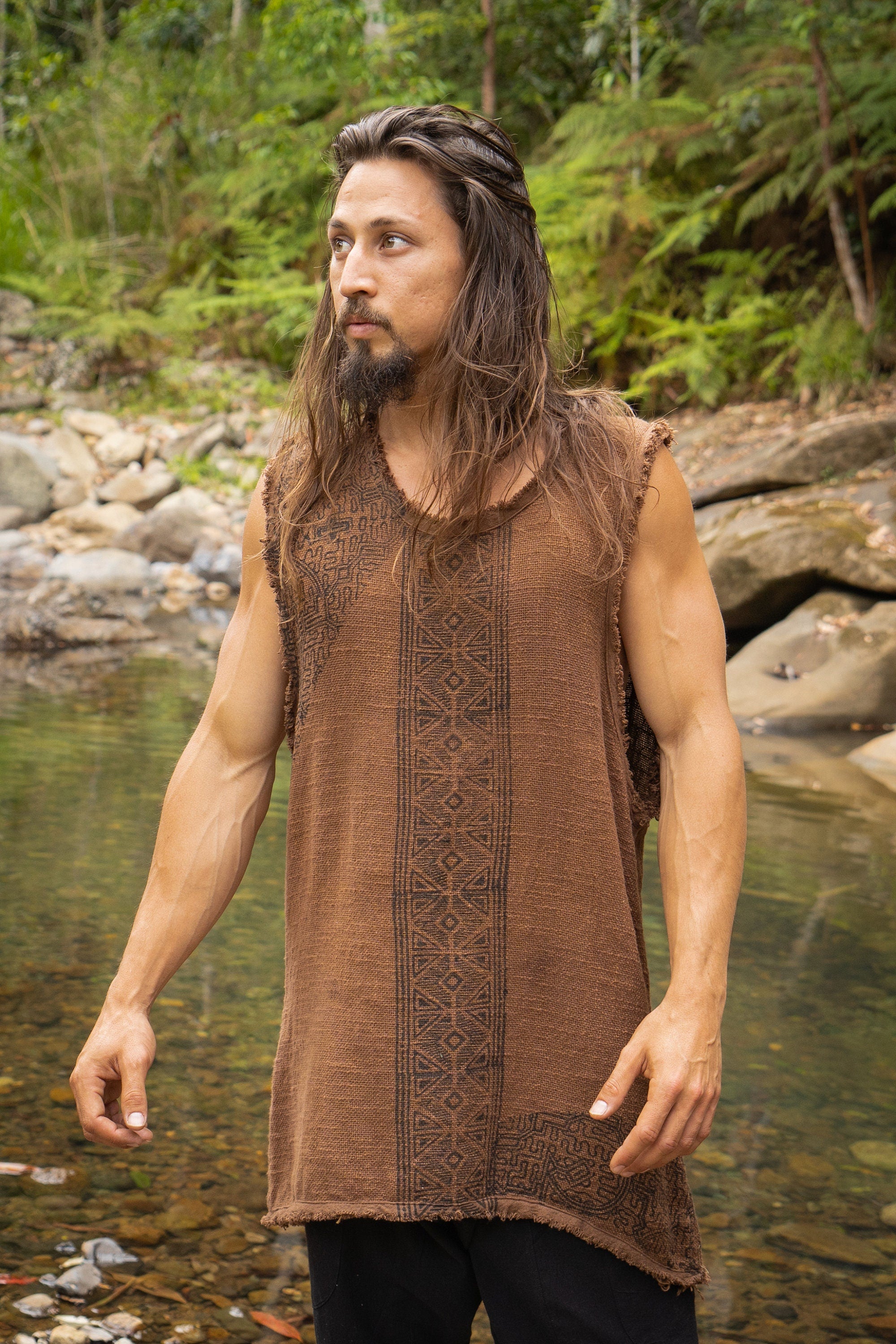 Our AKAU shamanic tank top features intricate block-printed shipibo tribal patterns that are hand-applied, giving each shirt a unique and authentic touch..