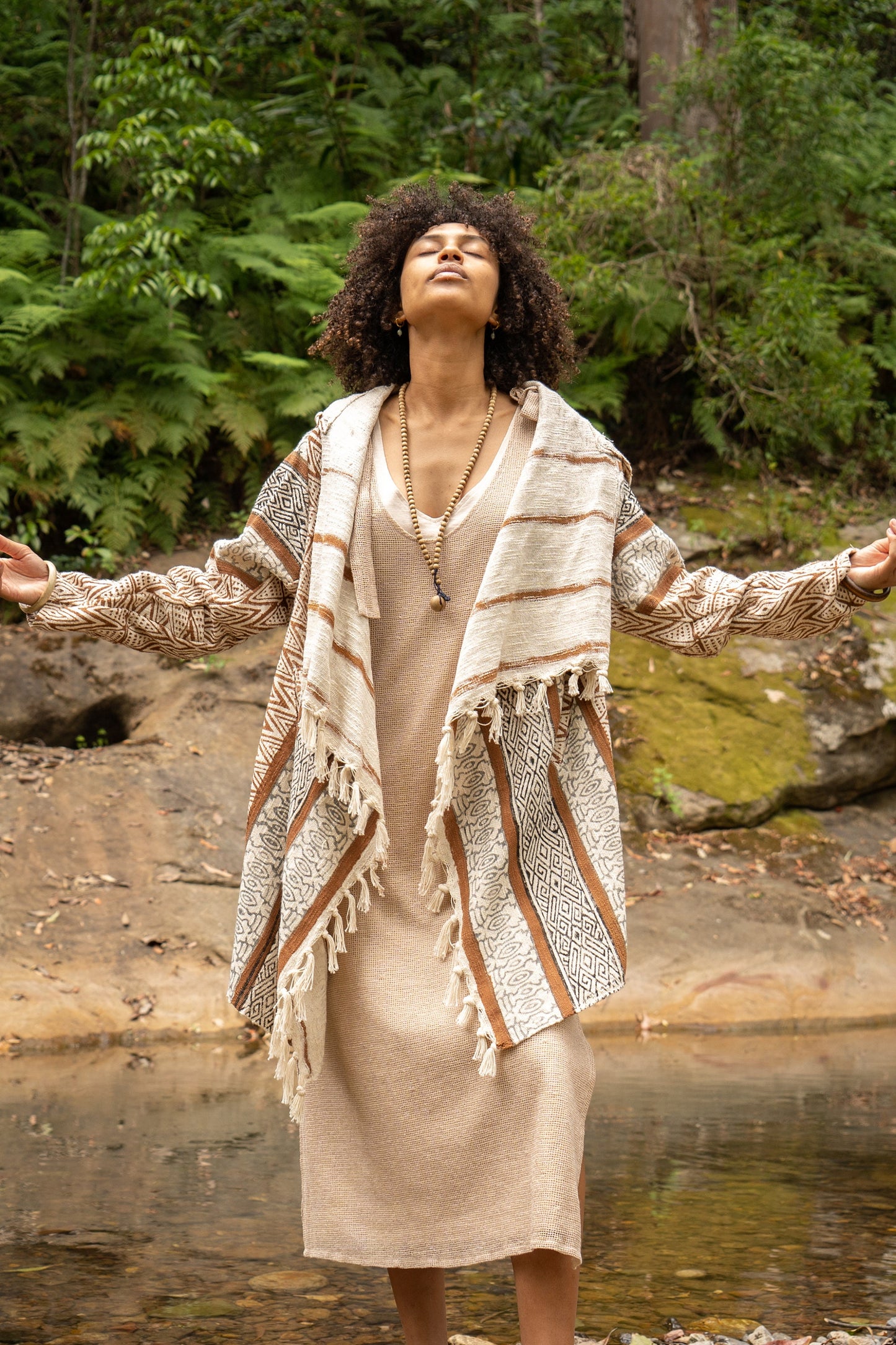 Introducing the JAPOMONO, a unique Jacket-Kimono-Poncho hybrid, it is an open hooded poncho handcrafted from natural cotton and naturally dyed in earthy tones.